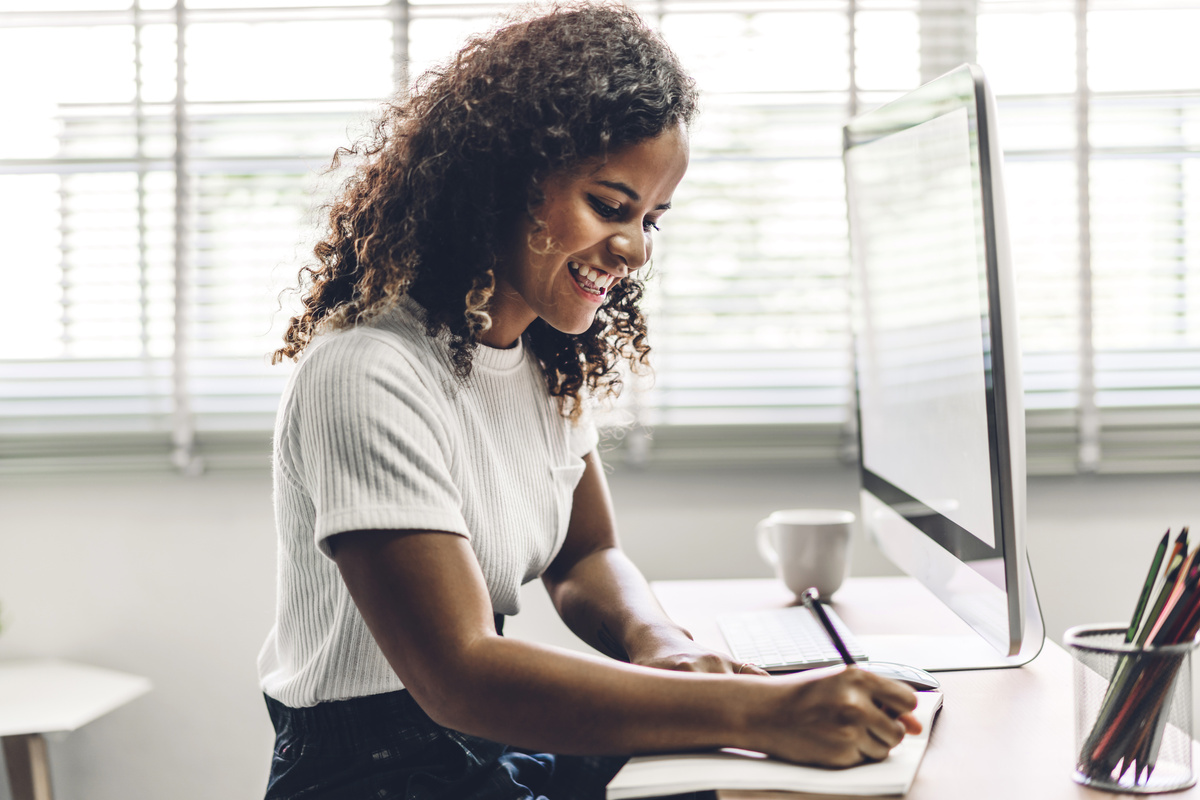 Woman Writing on a Desk 